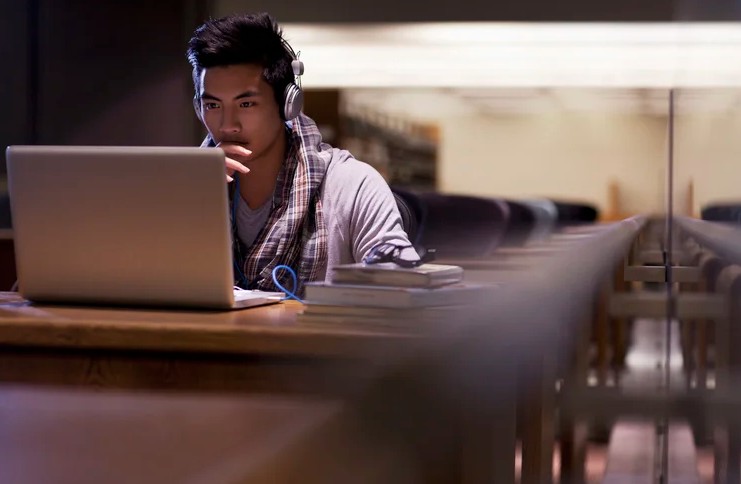 student in library