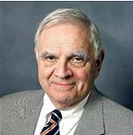 a person in a gray suit in seated